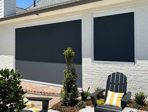 Motion screens installed around a pool area to reduce sun exposure and improve outdoor comfort in Lafayette, LA