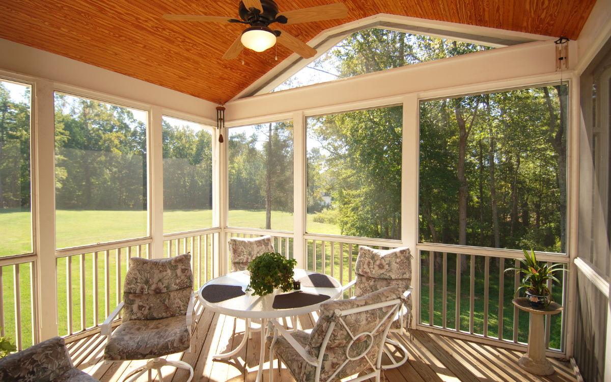 Motion screens installed on a screened porch with seating area for enhanced comfort in Lafayette, LA