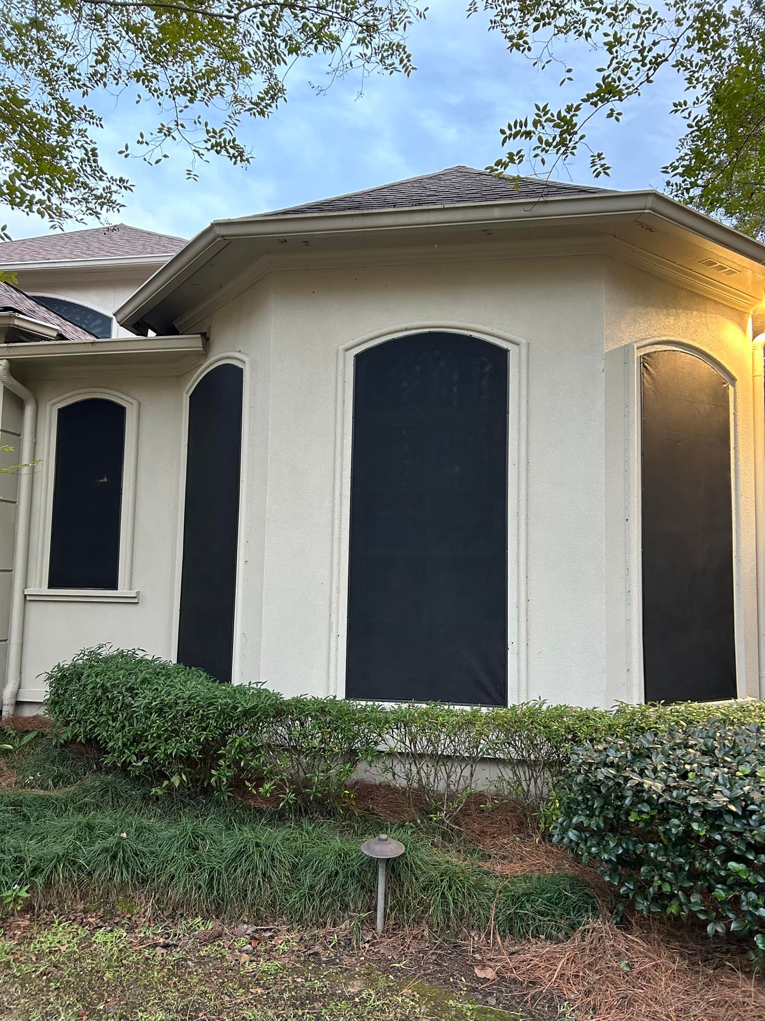 Fixed motion screens installed on a backyard shed for airflow and protection in Lafayette, LA