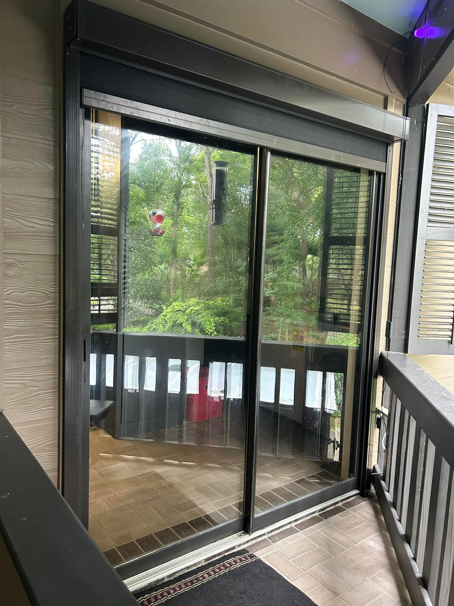 Motorized window motion screens installed to reduce glare and heat in Lafayette, Louisiana