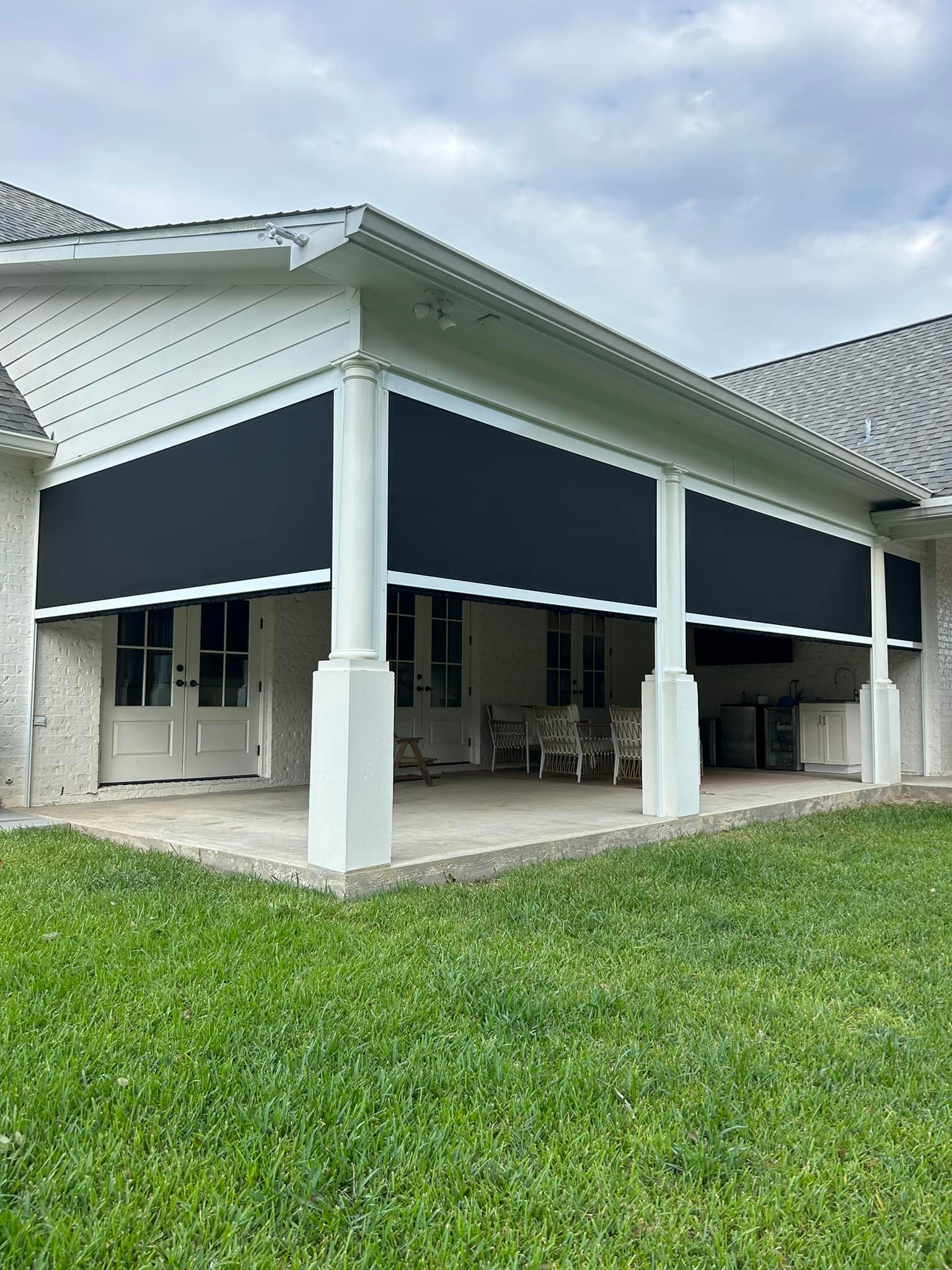Covered patio motion screens installed for outdoor comfort and sun protection in Lafayette, LA